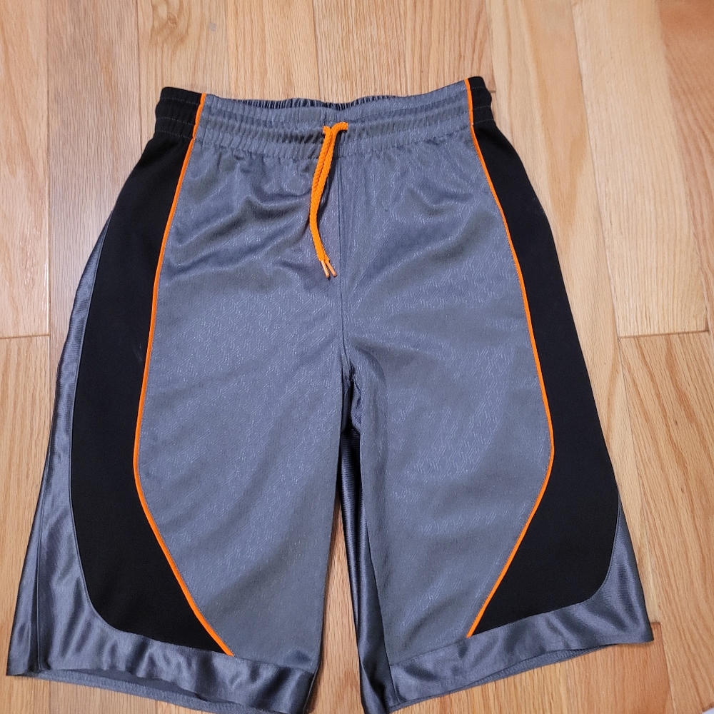 Boys grey, black and orange basketball shorts.